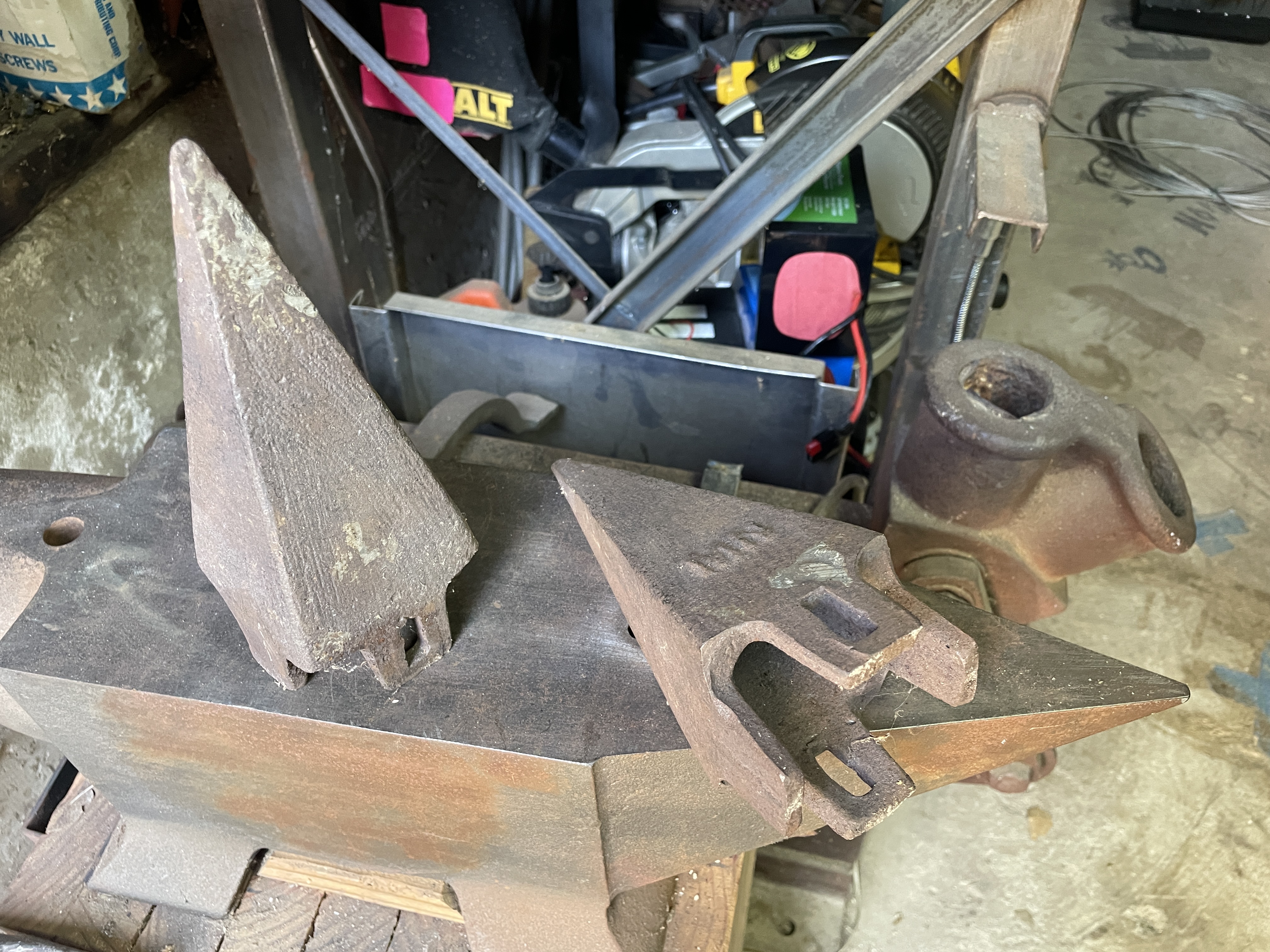 Heavy iron dredger teeth from San Diego bay dredger, looking like robot T-rex teeth